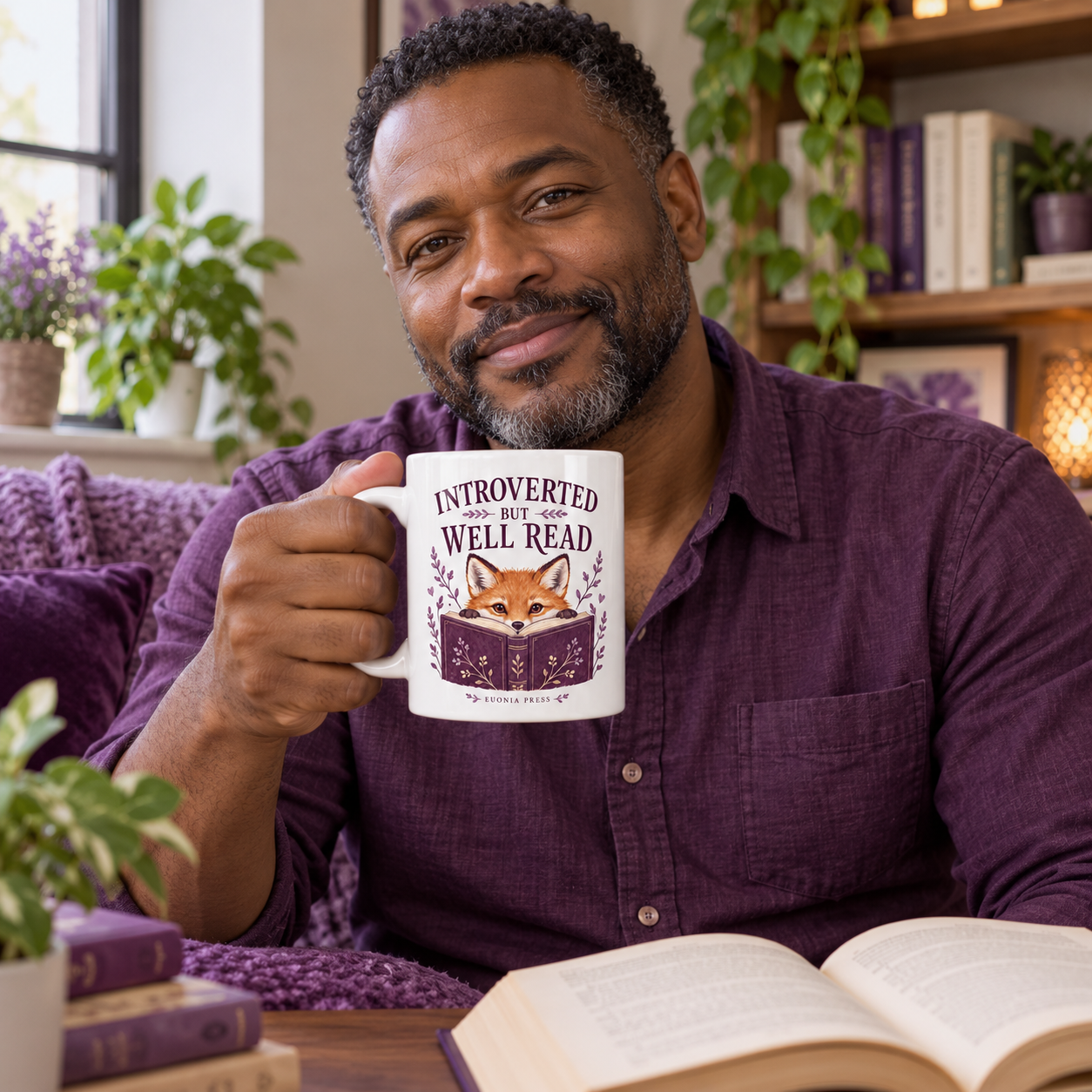 Introverted but Well Read Mug by Euonia Press in use during a reading or writing break