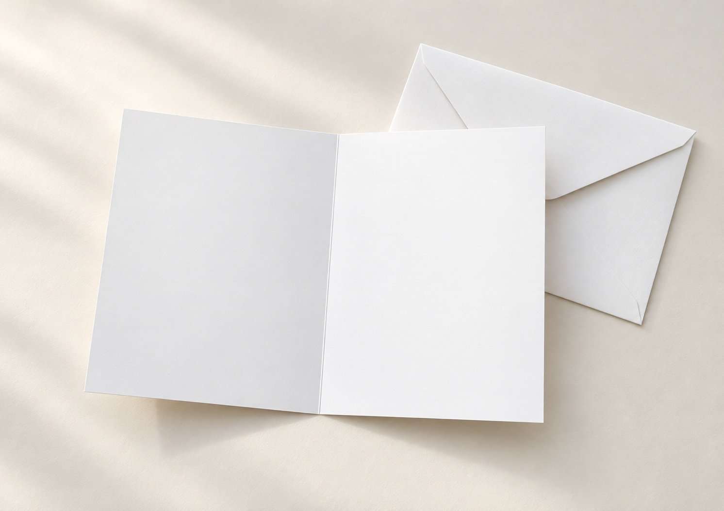 A5 author greeting card opened to show blank inside pages and an envelope